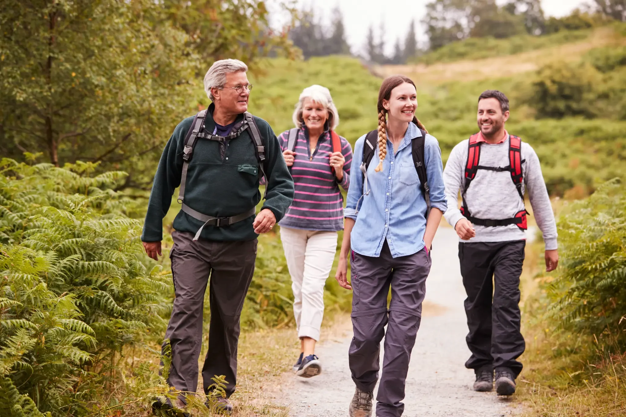 Multigenerational family hiking together